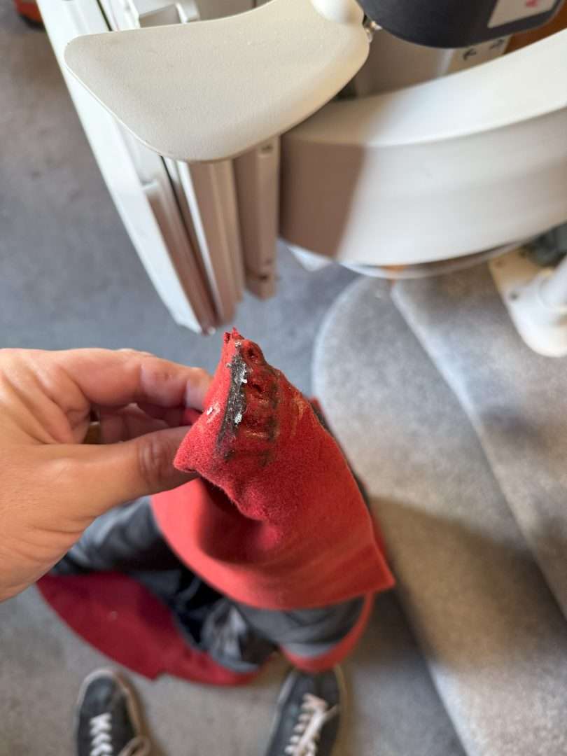 Dead coat stuck in a stairlift