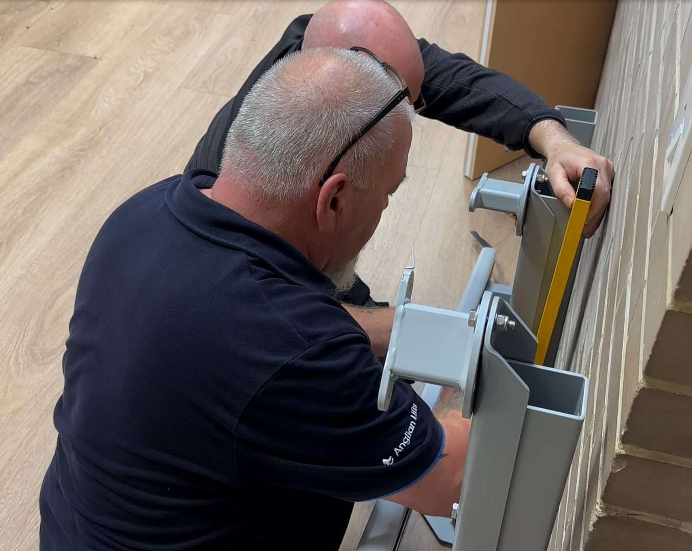 Installing a wheelchair lift rail